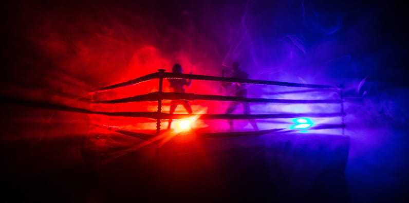 Boxe boxe sur un ring avec un fond rouge et bleu