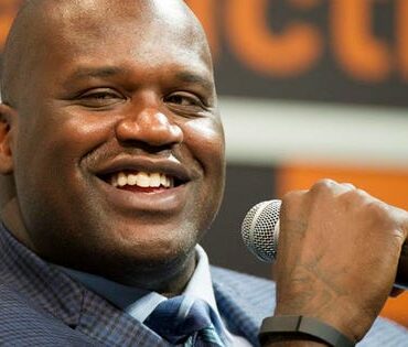 How much of Papa John's does Shaq own?