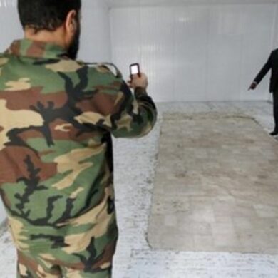 Where is Gaddafi buried?