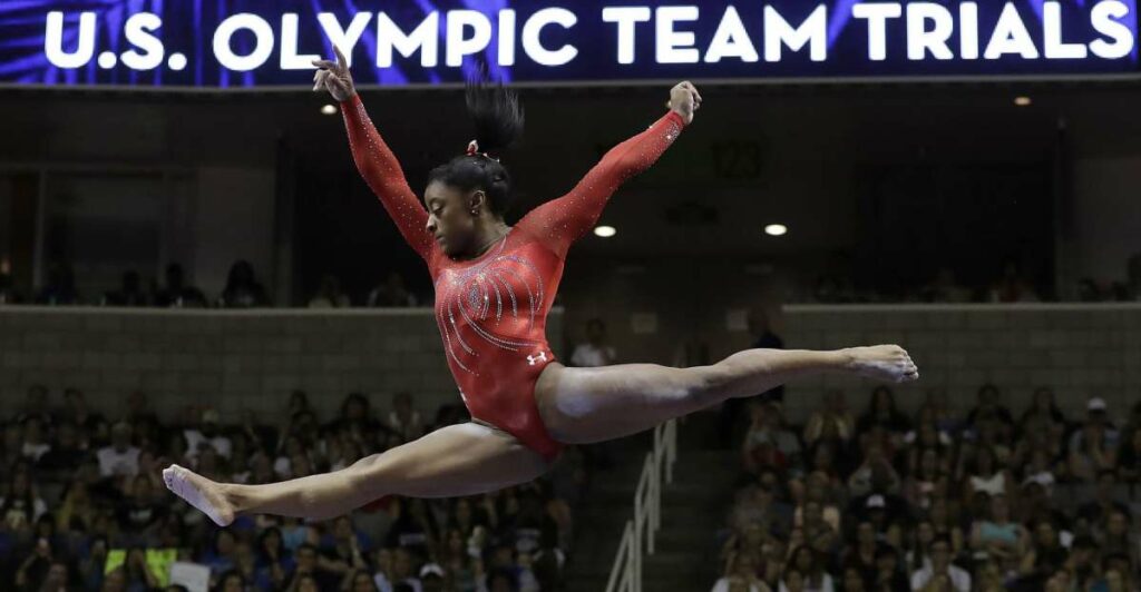 Does Simone Biles own a gym?