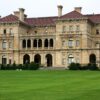 Who owns the mansions in Newport?