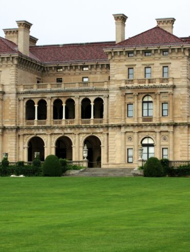 Who owns the mansions in Newport?